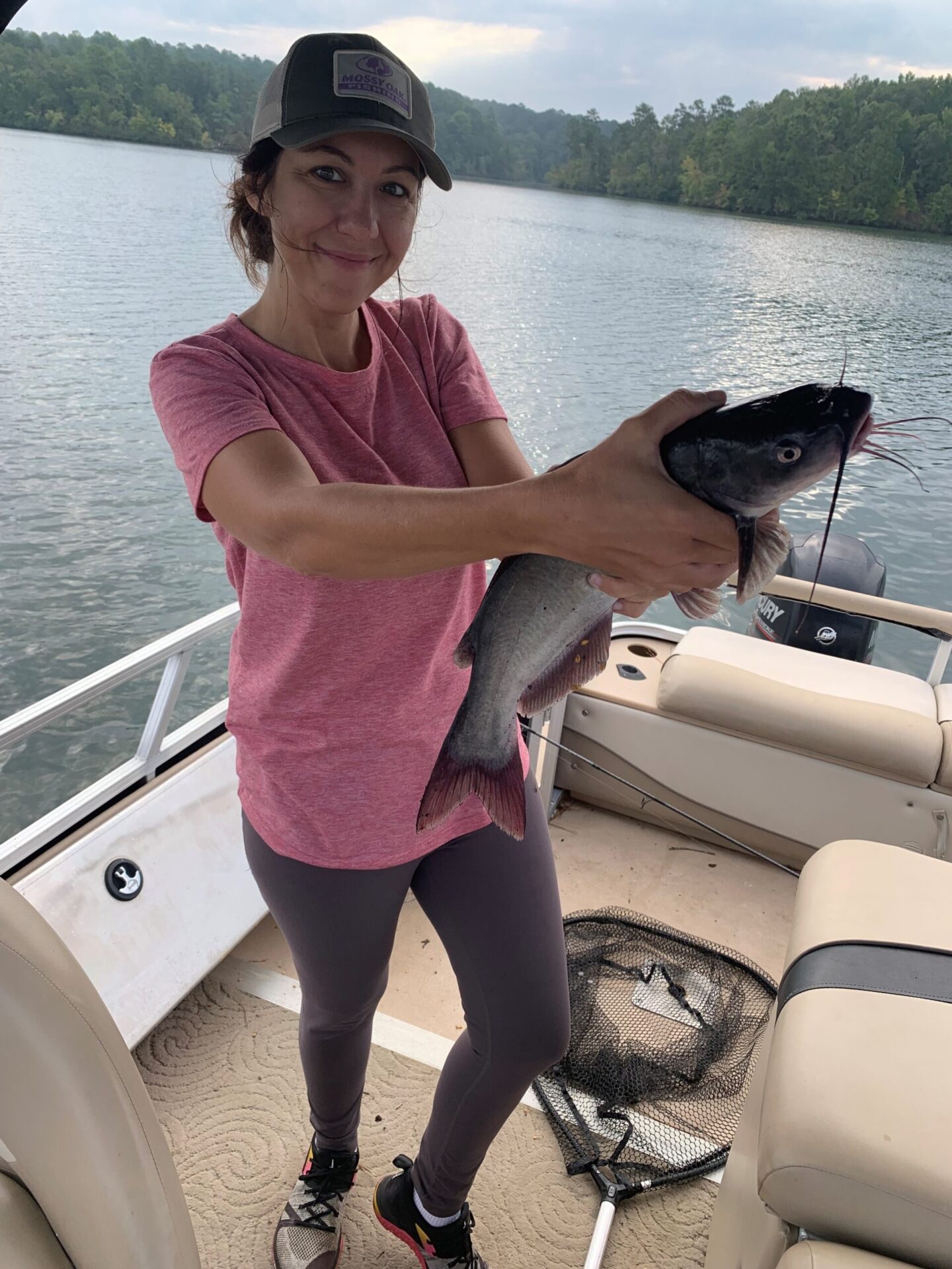 girl holding catfish 