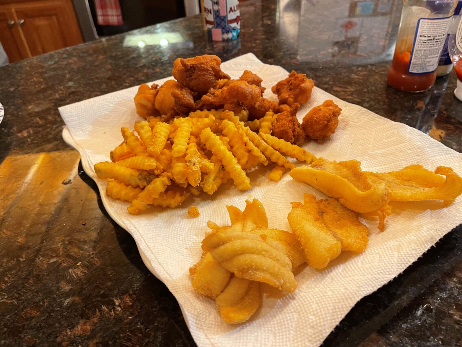 catfish, french fries, and hush puppies