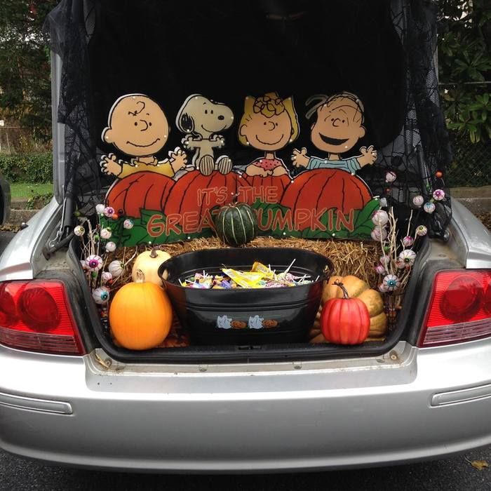 trunk of car with halloween candy in back 