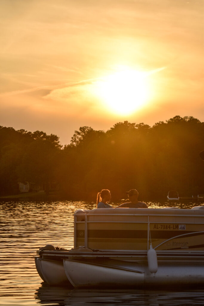 couple on boat at sunset