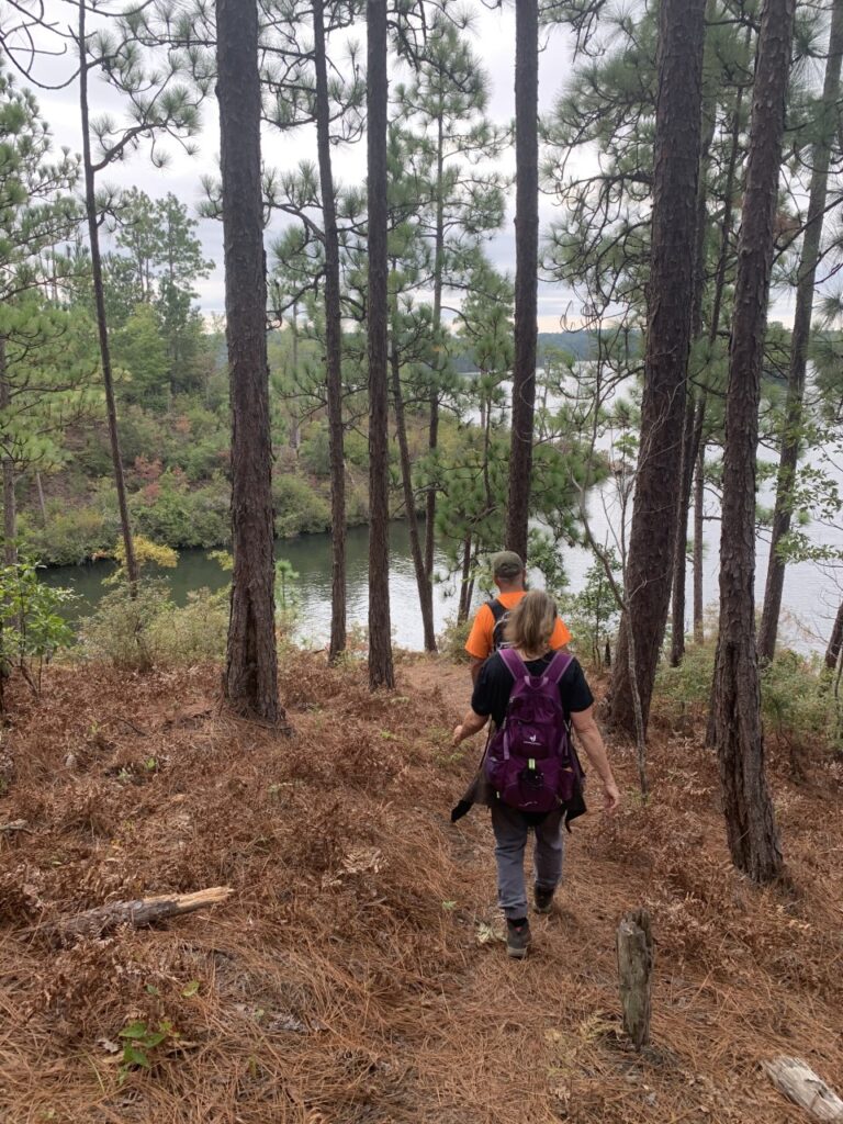 man and woman on hiking trail 