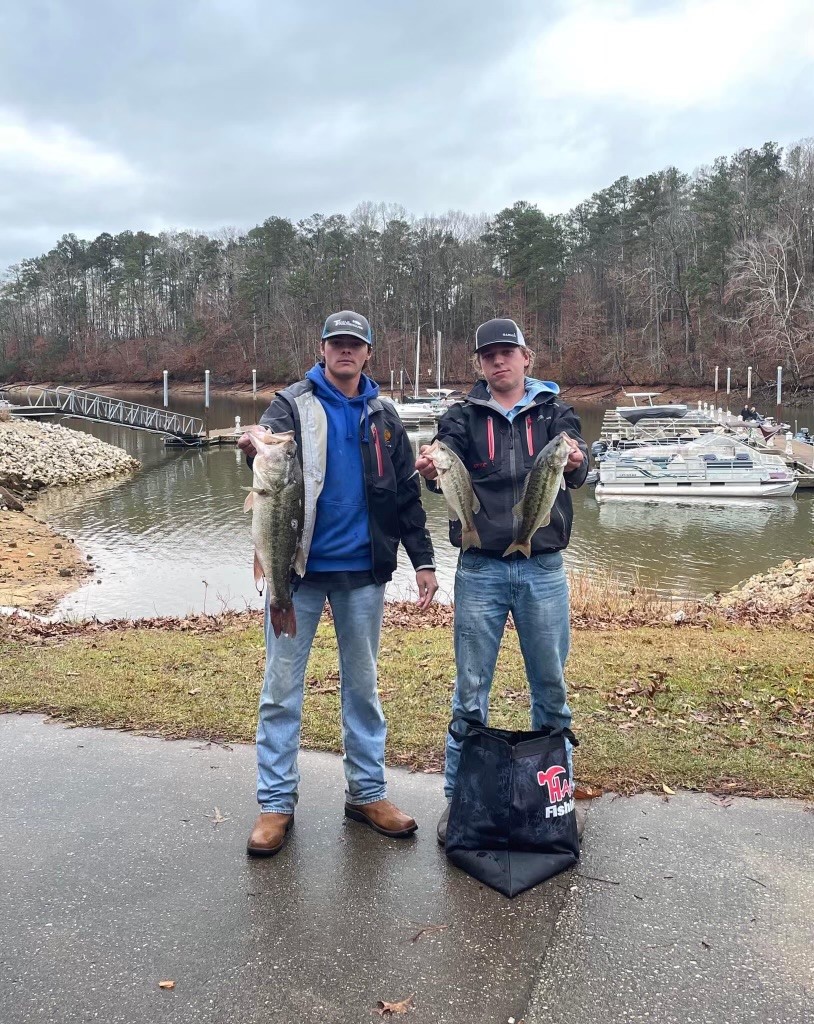 boys holding fish