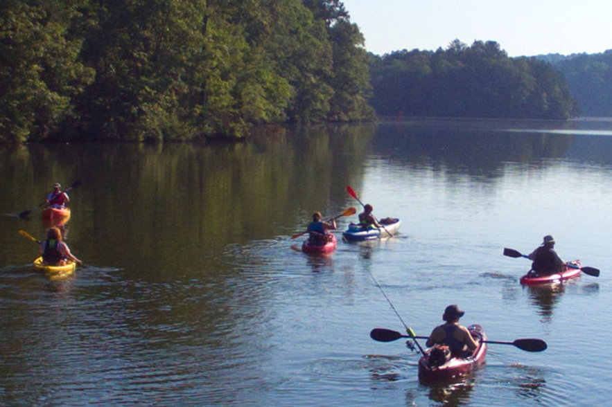 people in kayaks