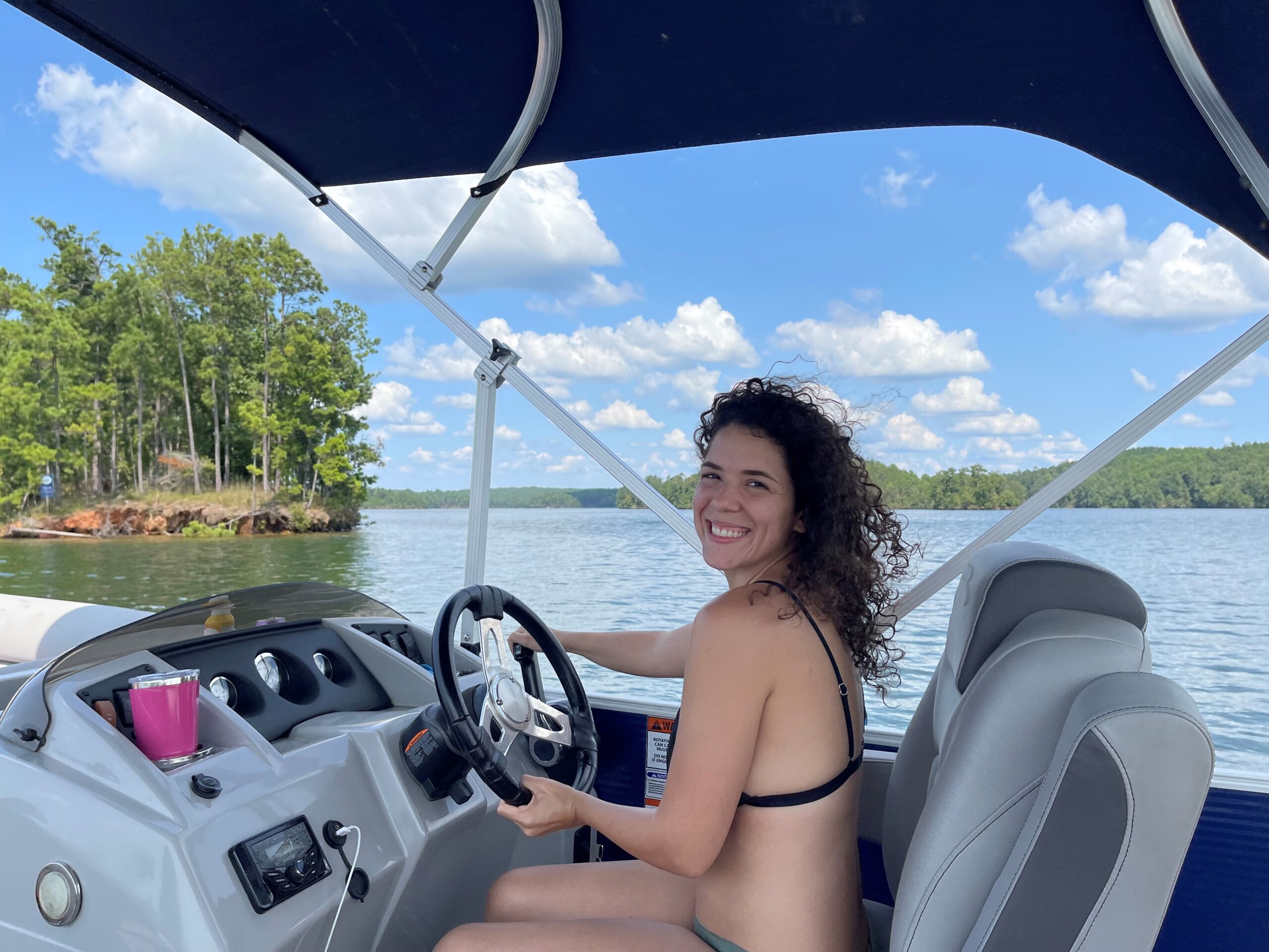 girl driving boat