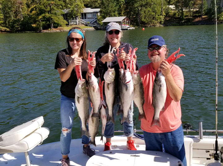 people holding fish