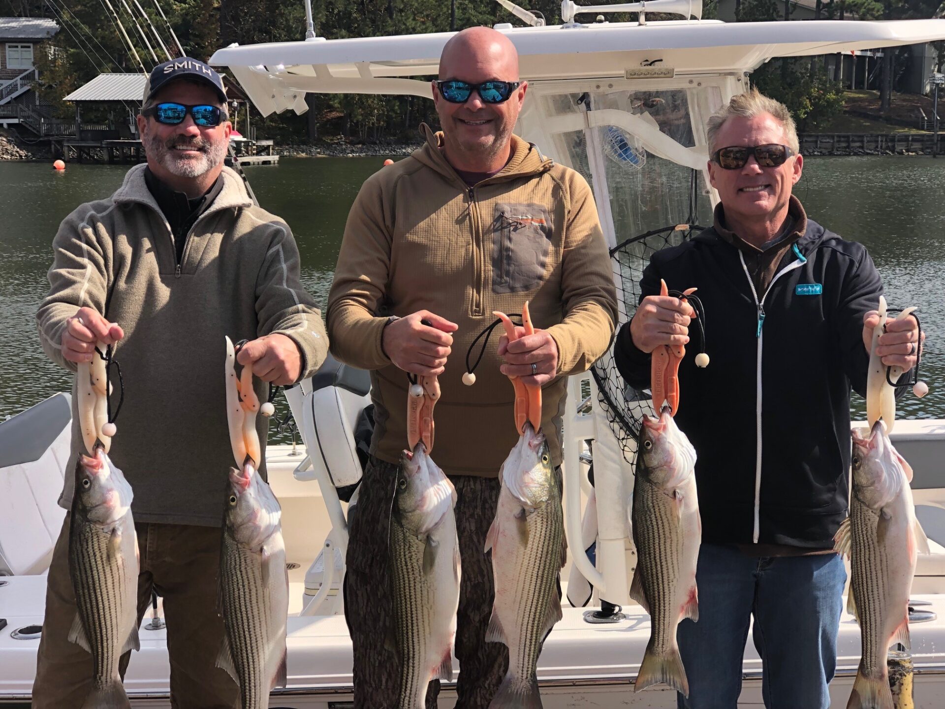 men holding fish