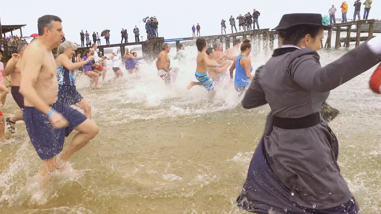 people running in the water