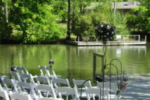 chairs set up for wedding by the water