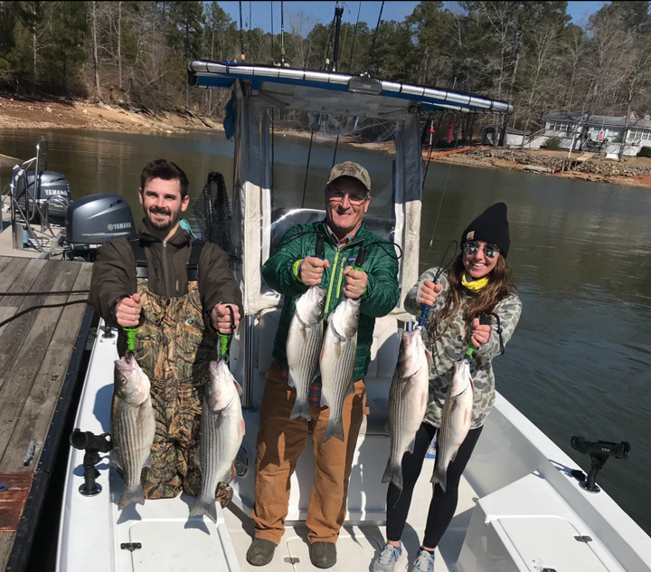 people holding fish