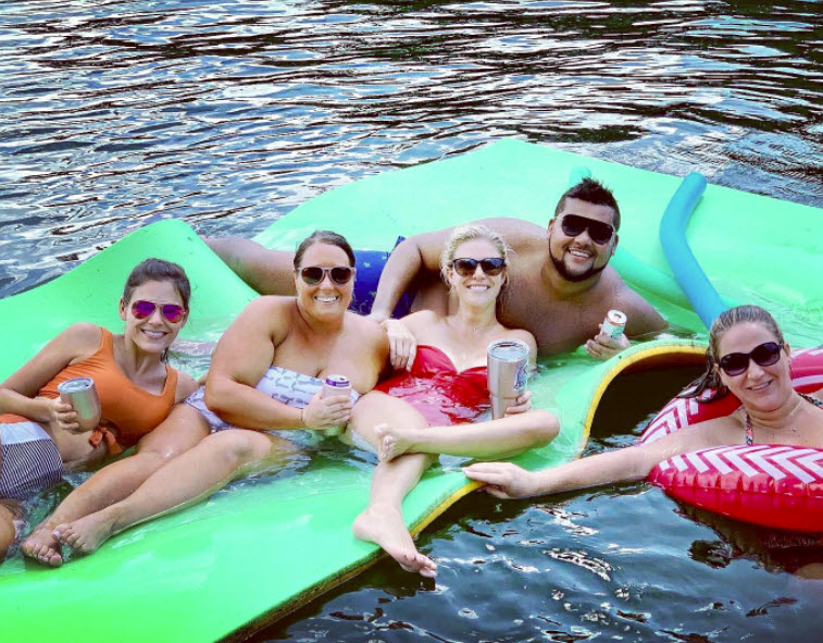 people on lake on floats lake martin