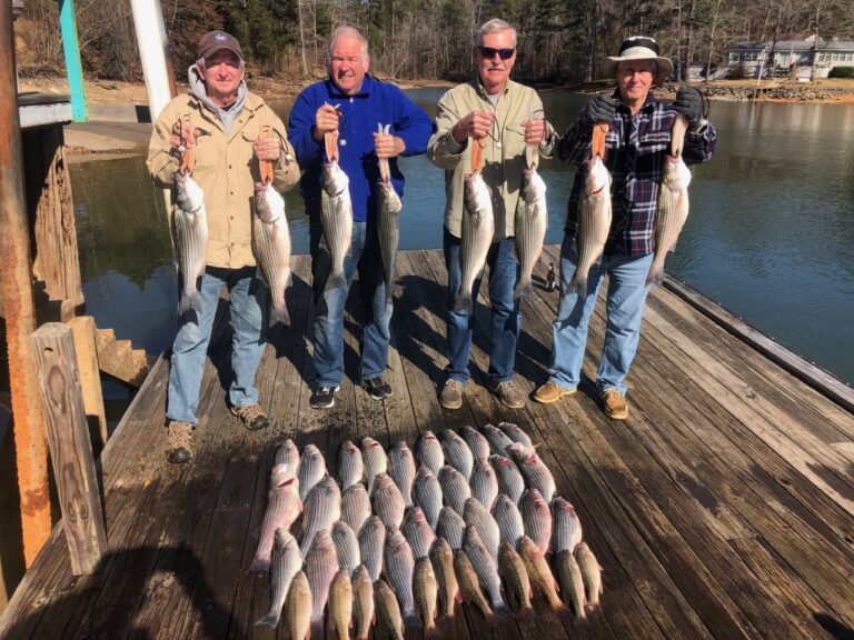 men holding fish