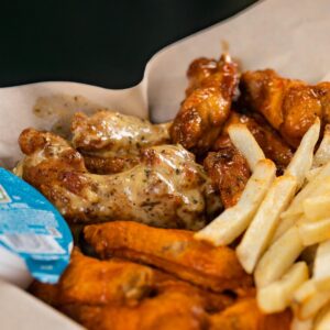 A plate of chicken wings and French fries