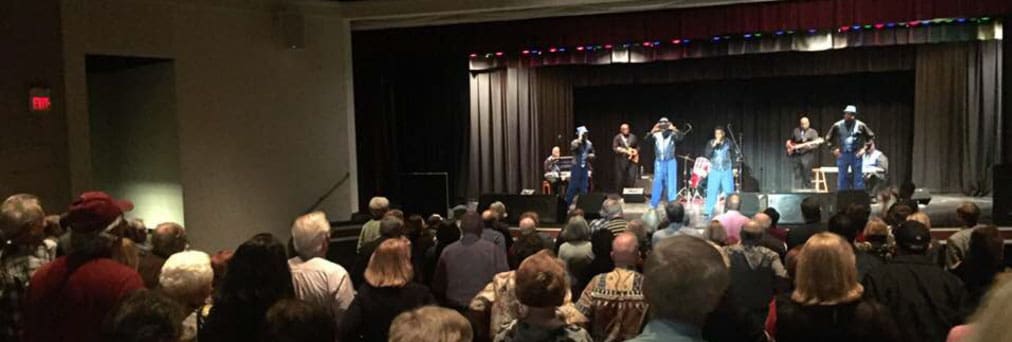 a band performing on the stage in a theater