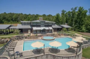 Aerial view of wedding venue with shaded tables and swimming pool